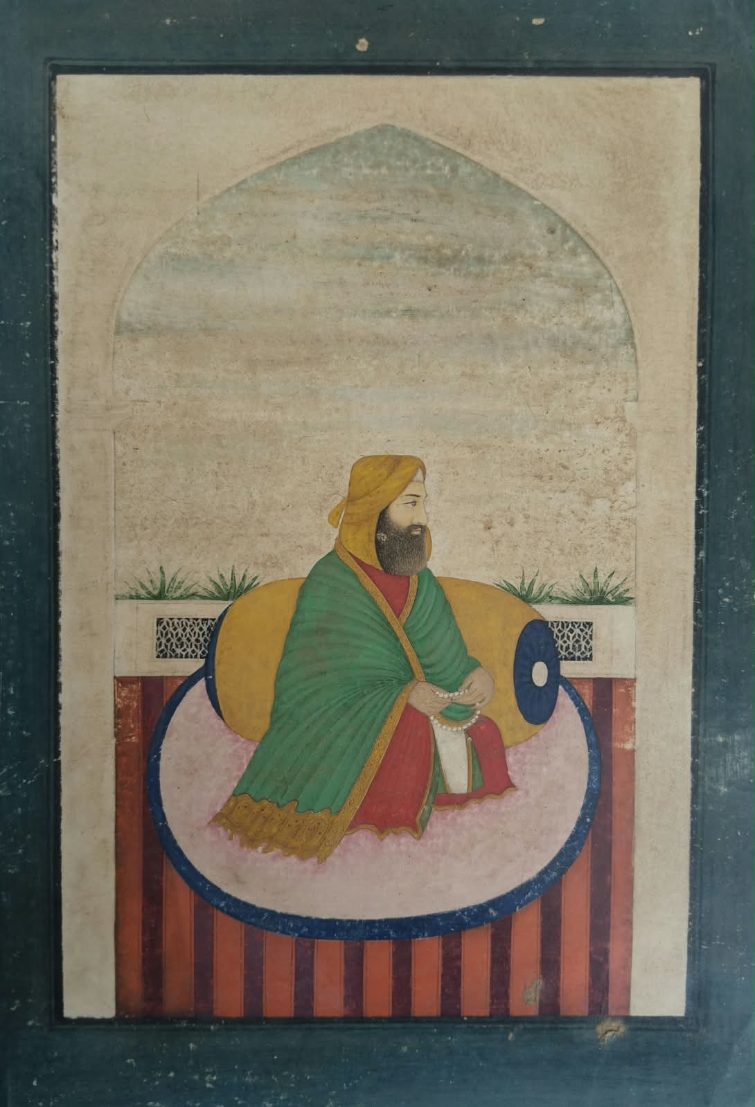 Mughal miniature painting depicting saint in traditional attire